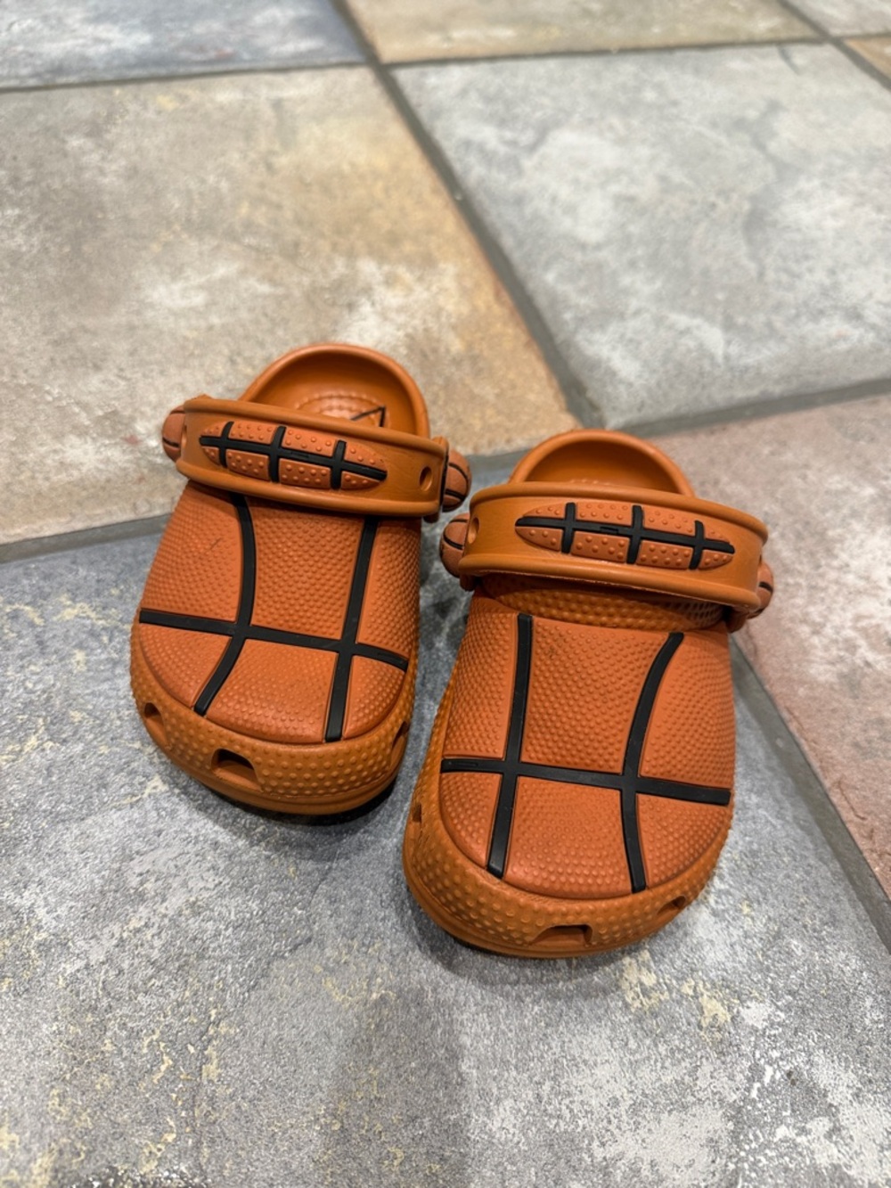 CROCS Kids Basketball-Pattern Clog Sandals in Orange with Black Accents